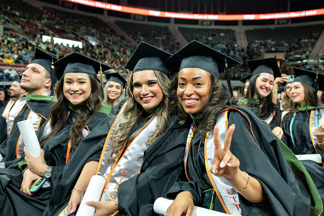 Construction workers signing a steel beam