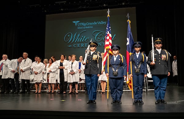 American flag saluting during the White Coat ceremony.