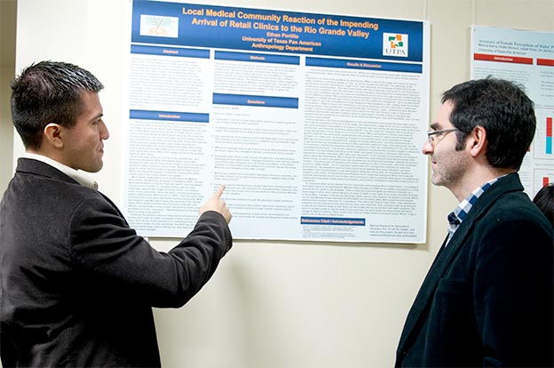 Anthropology undergrad Ethan Portillo presenting a research poster at an SBS Research Conference in 2014 with Dr. Servando Hinojosa