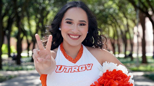 Dance Team member showing the V's Up sign.