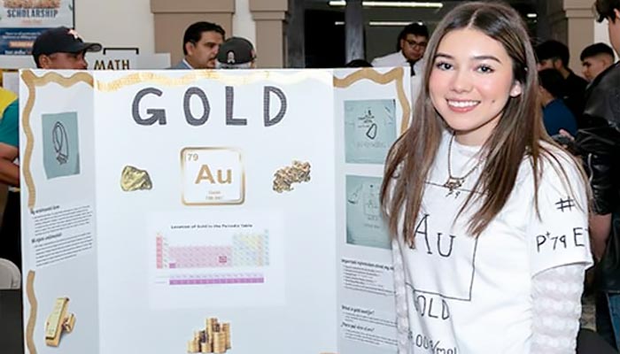 Chemistry student and her research project poster on the element gold Page Banner 