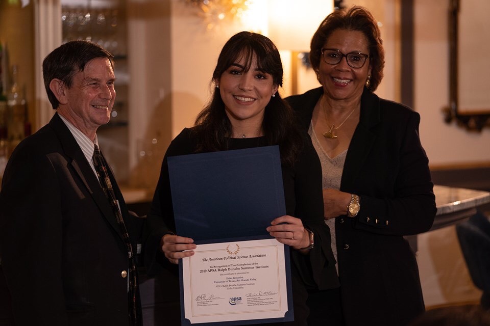 Erika Gonzalez holds certificate while posing for photo