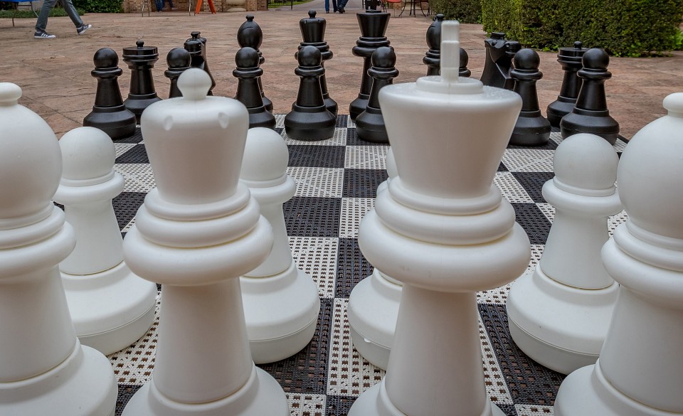 large chess pieces on big board