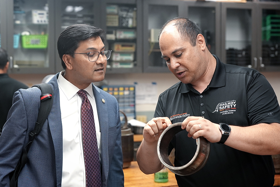 Amit Bose, administrator of the Federal Railroad Administration, along with Dr. Constantine Tarawneh, Louis A. Beecherl, Jr. Endowed Professor and UTCRS director, visit the Bearing Lab in the UTRGV Engineering Building.  (UTRGV Photo by Jesus Alferez)