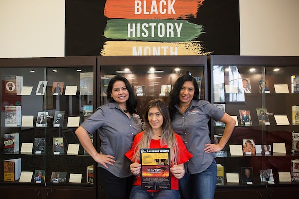 Librarians pose for Black History Month photo.