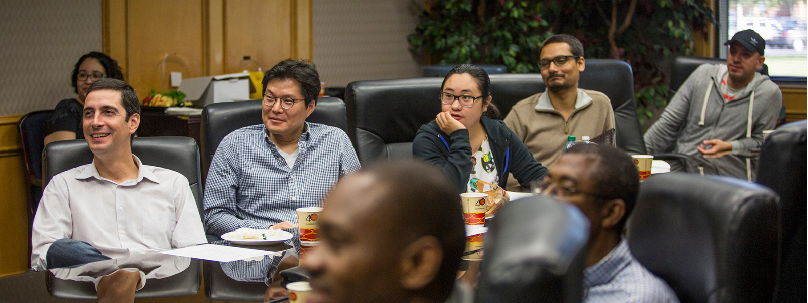 Doctorate students in class meeting setting.