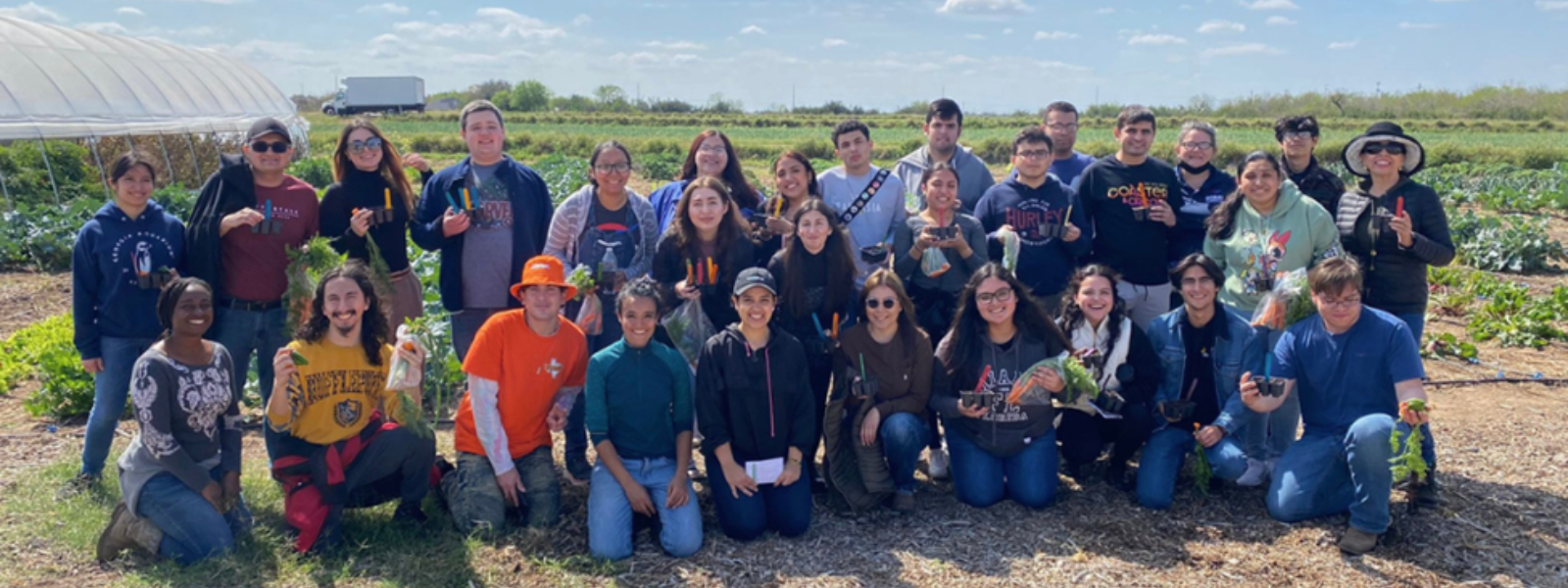 Group of students outdoors posing for the camera. 