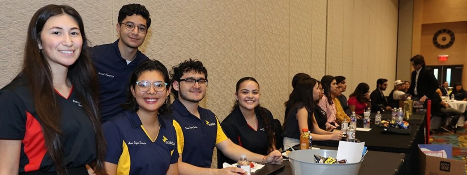 Members of ENACTUS and Financial Literacy Program smile at Vackar TalkX RGV Economic Outlook Symposium